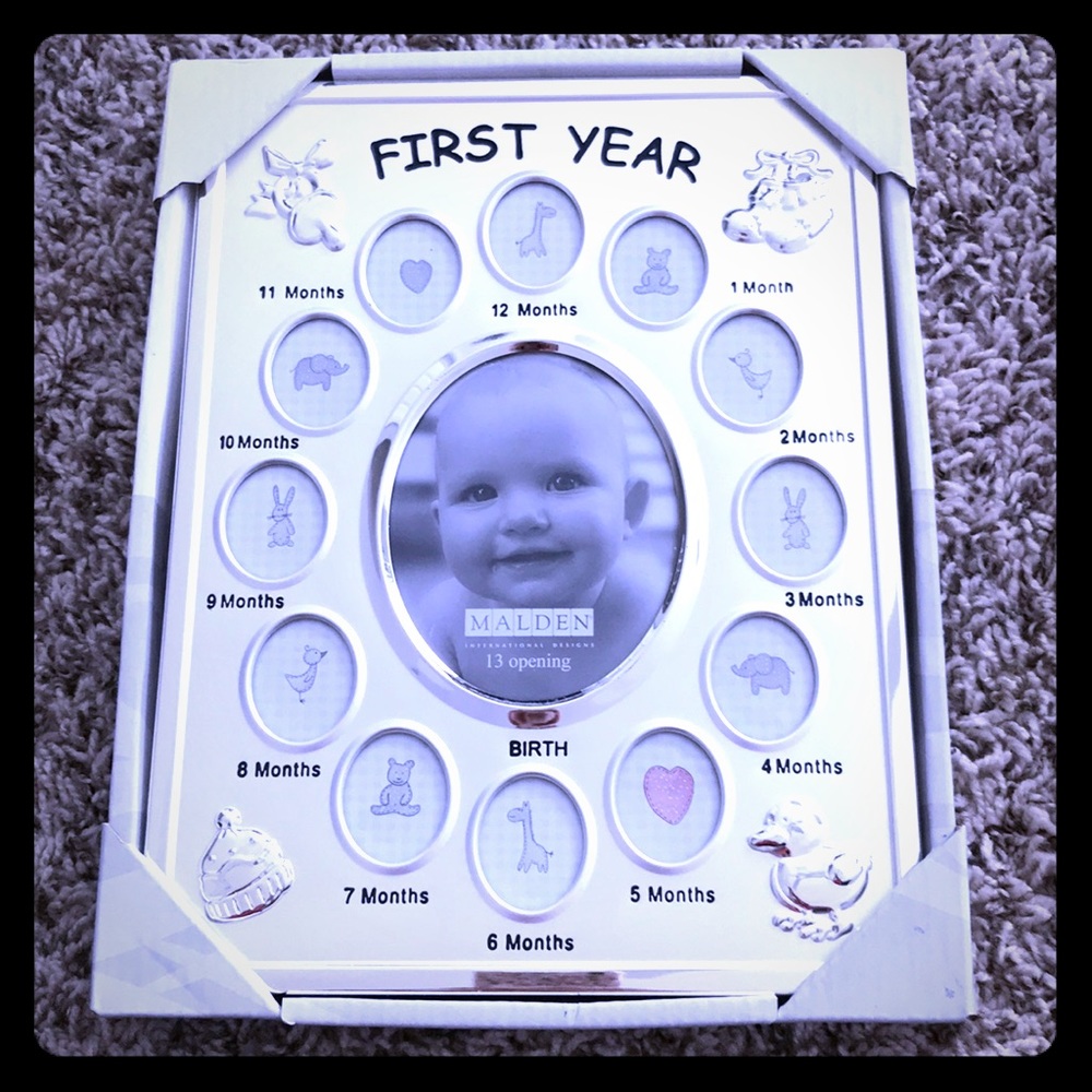 First year photo frame. Never opened.